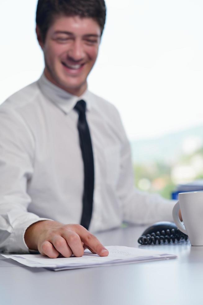 happy young business man at office photo