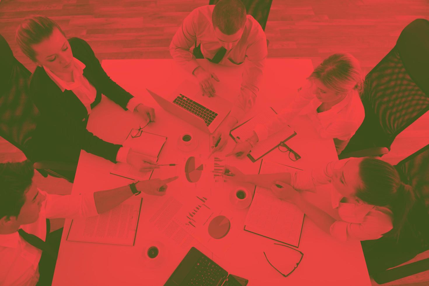 Group of young business people at meeting photo