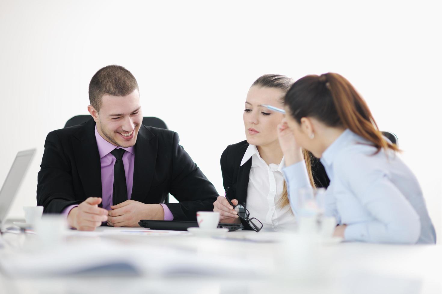 Group of young business people at meeting photo