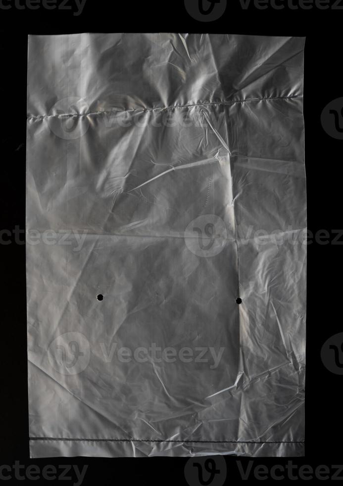 transparent plastic bag with zipper on black background for mockups photo