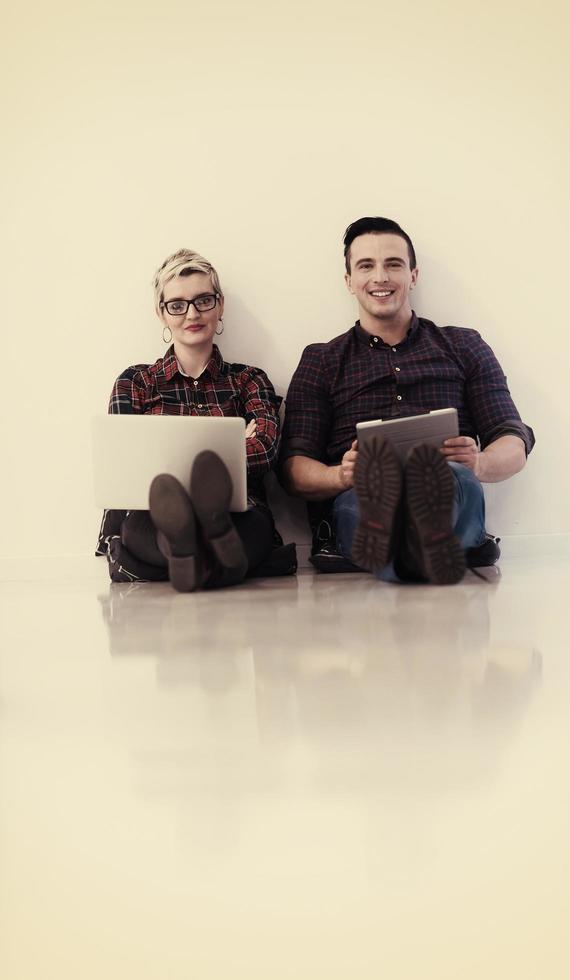 startup business, couple working on laptop computer at office photo