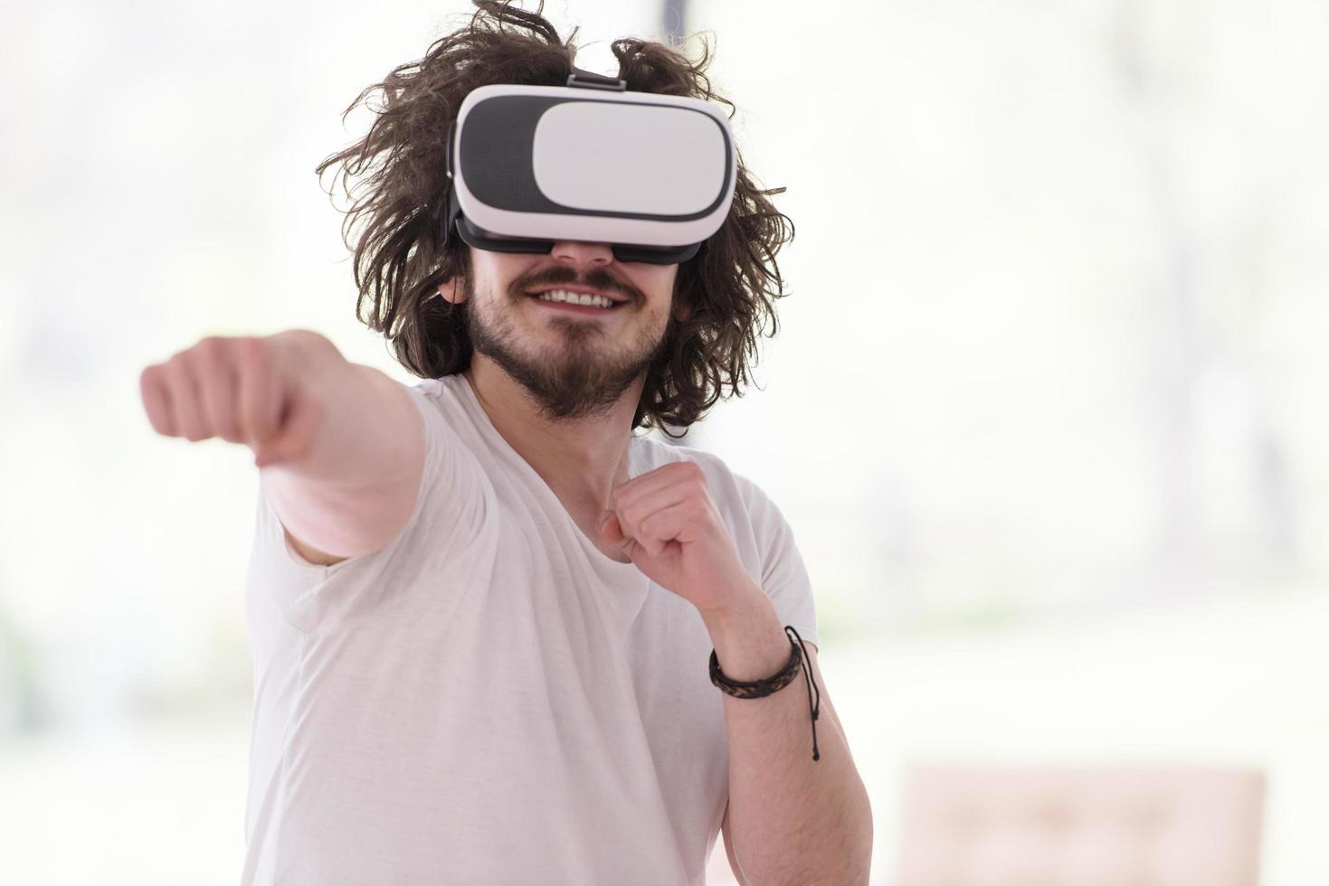 man using VR-headset glasses of virtual reality photo