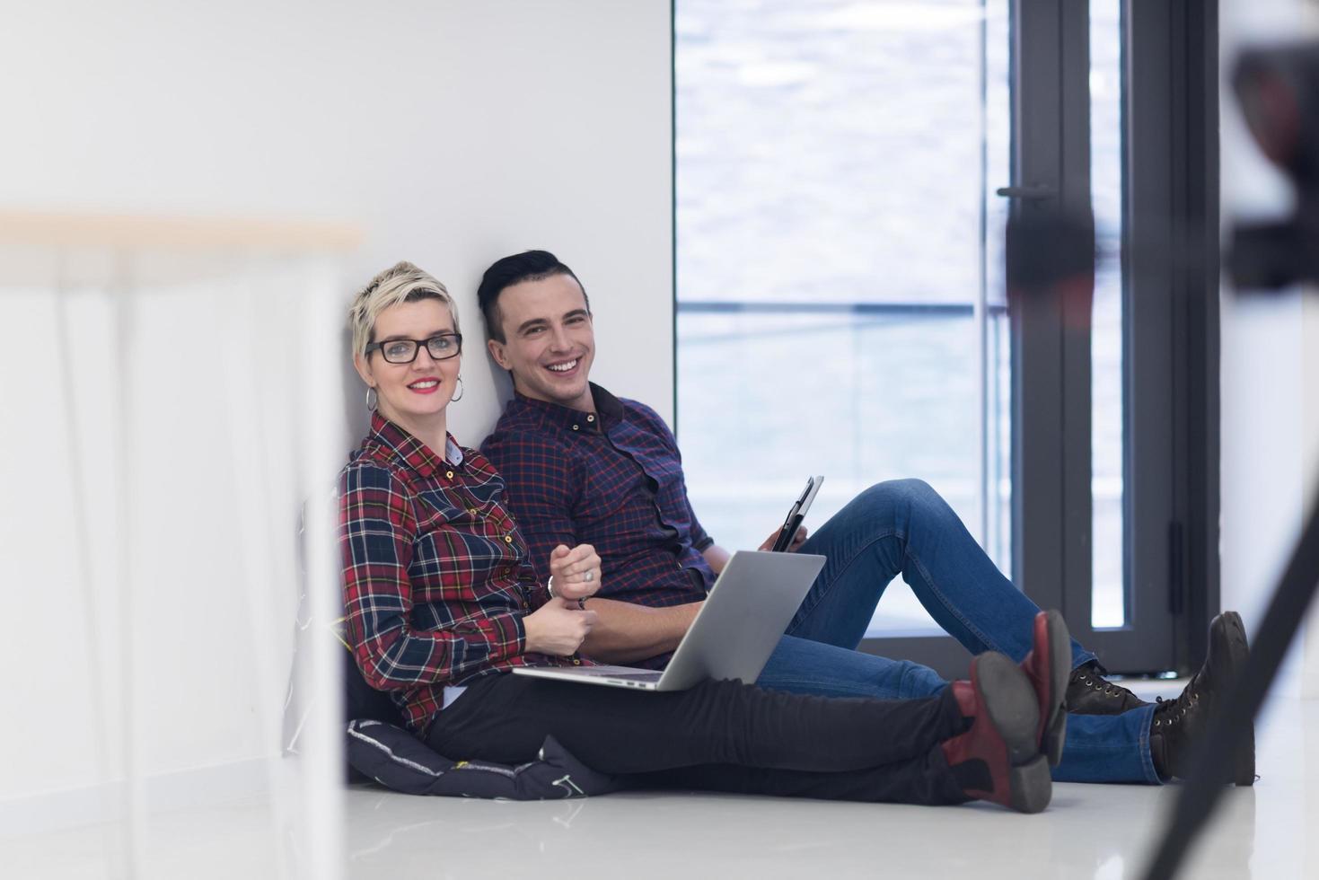 startup business, couple working on laptop computer at office photo