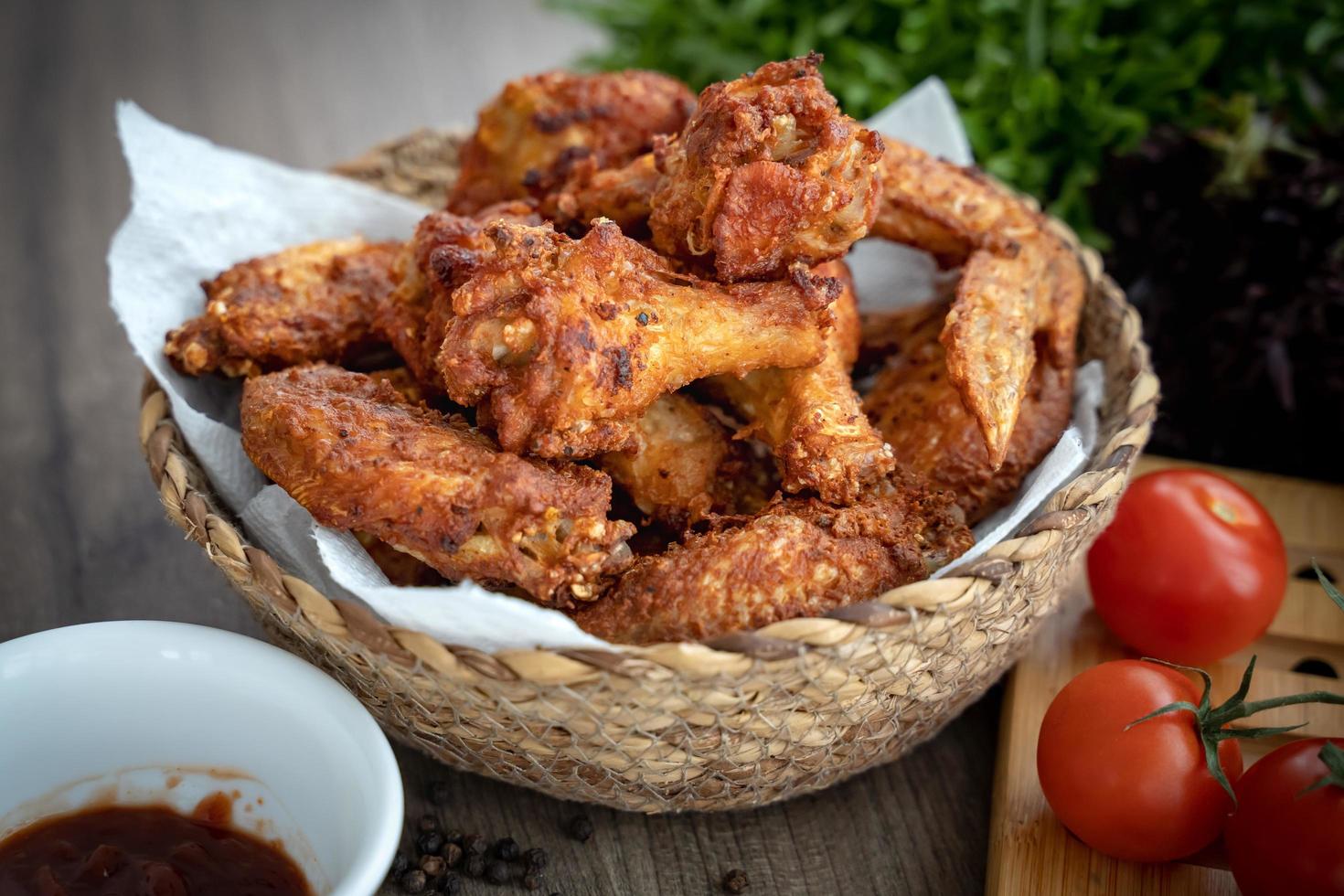 Breaded crispy fried kentucky chicken drumctick in the basket photo
