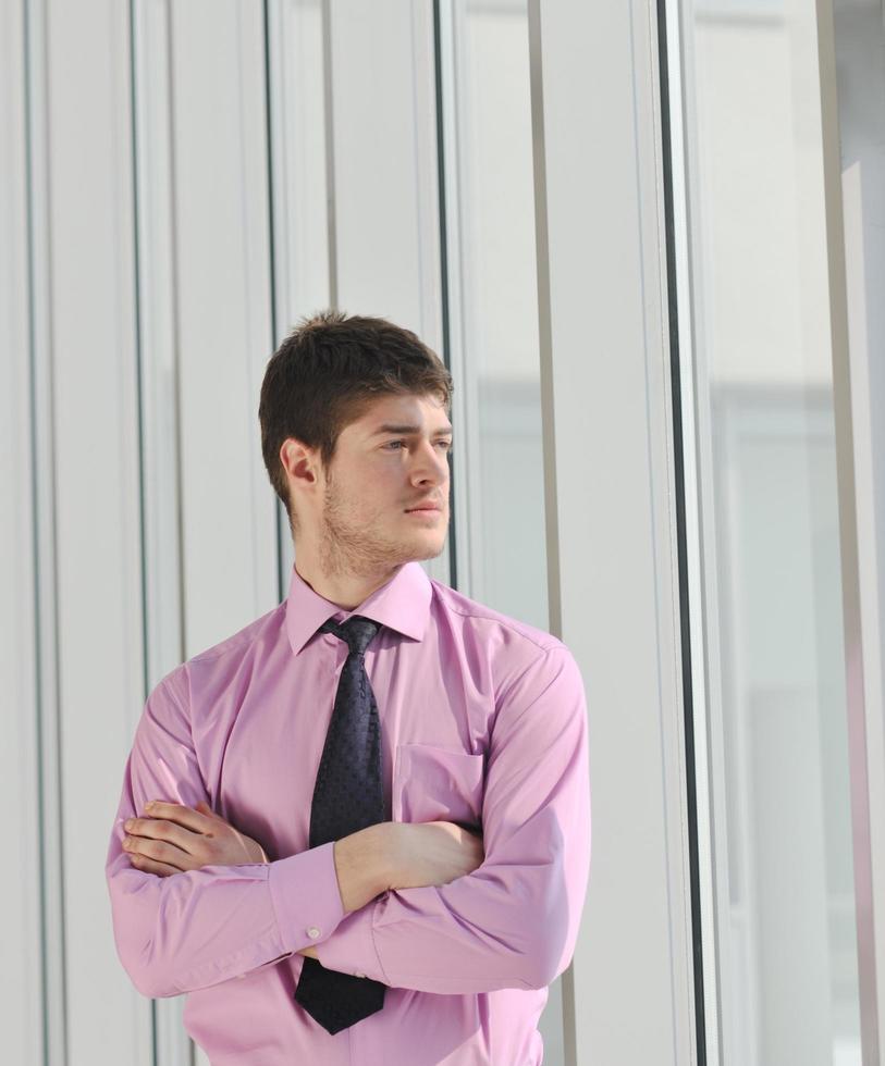 young business man alone in conference room photo