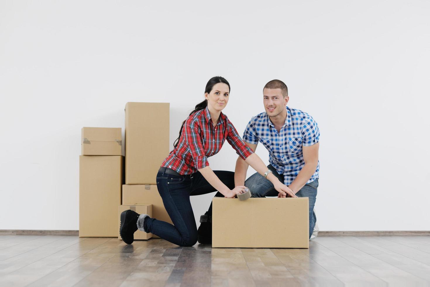 Young couple moving in new house photo