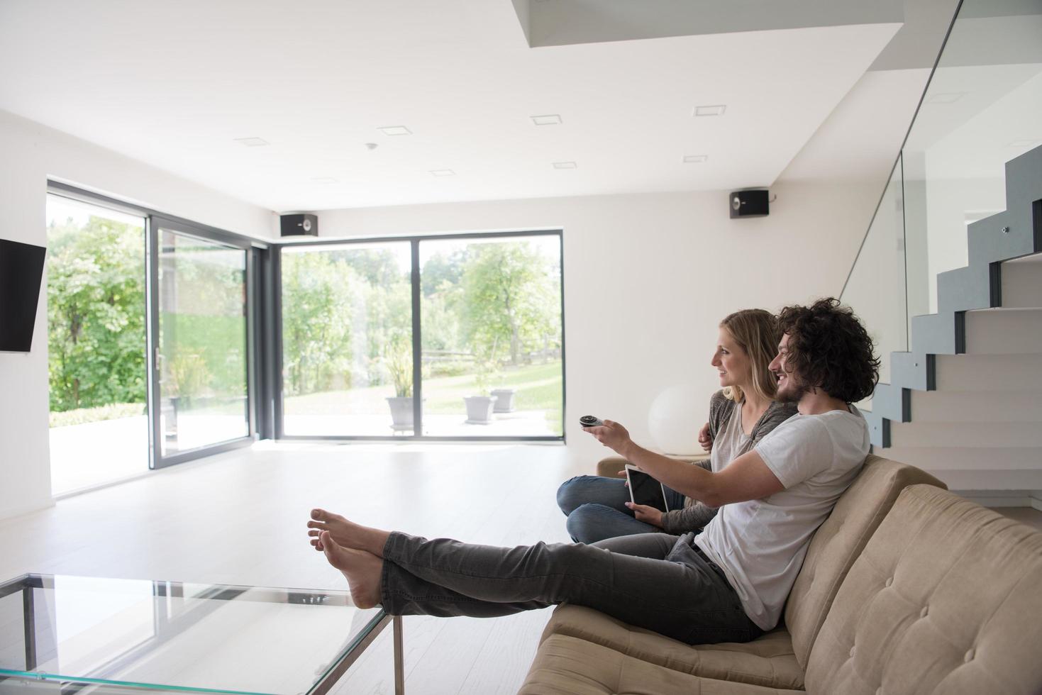 young couple relaxes in the living room photo