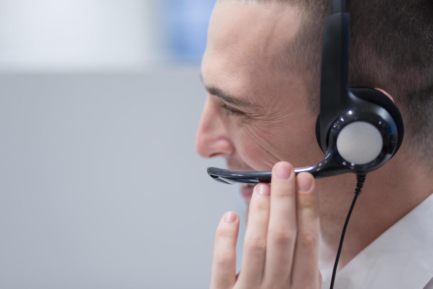 male call centre operator doing his job photo