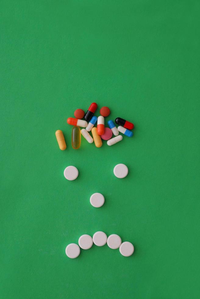 headache caricature with pills photo