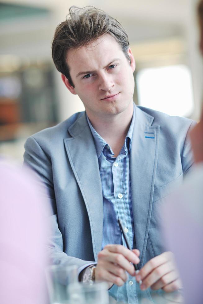 young business man alone in conference room photo