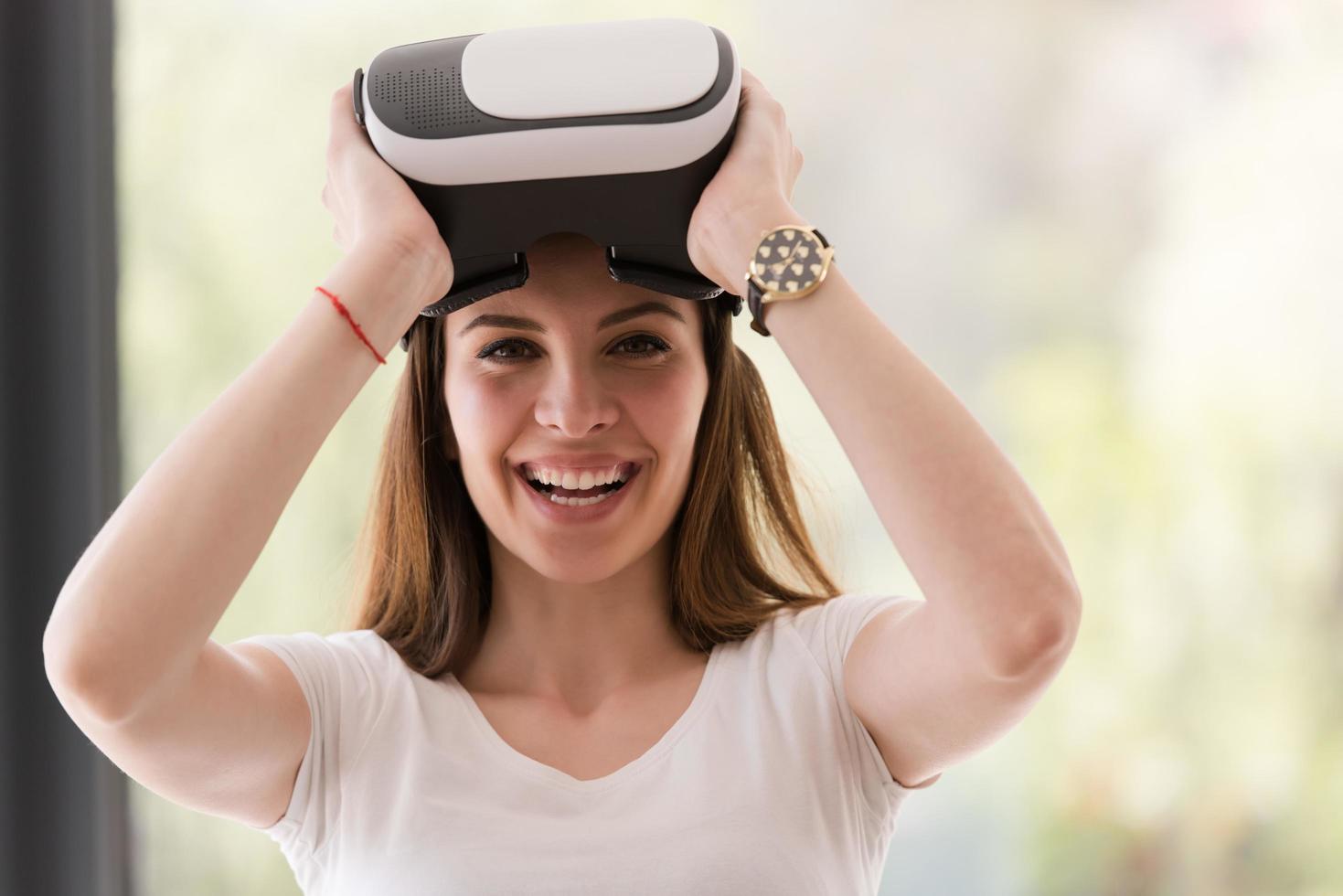 woman using VR-headset glasses of virtual reality photo