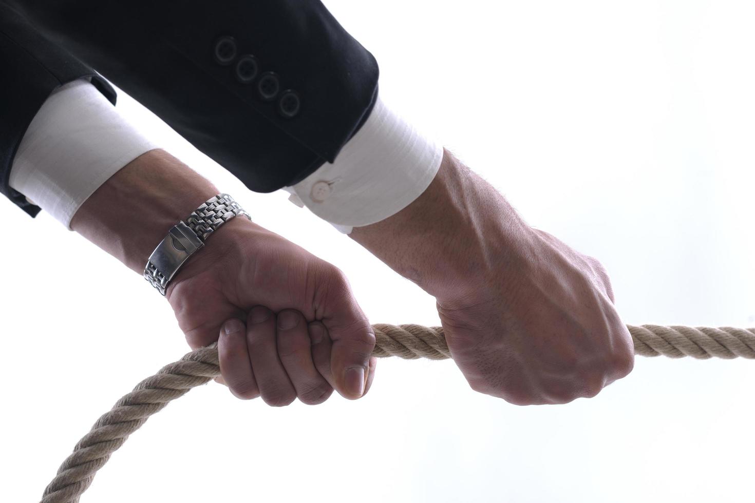 business man with rope isolated on white background photo