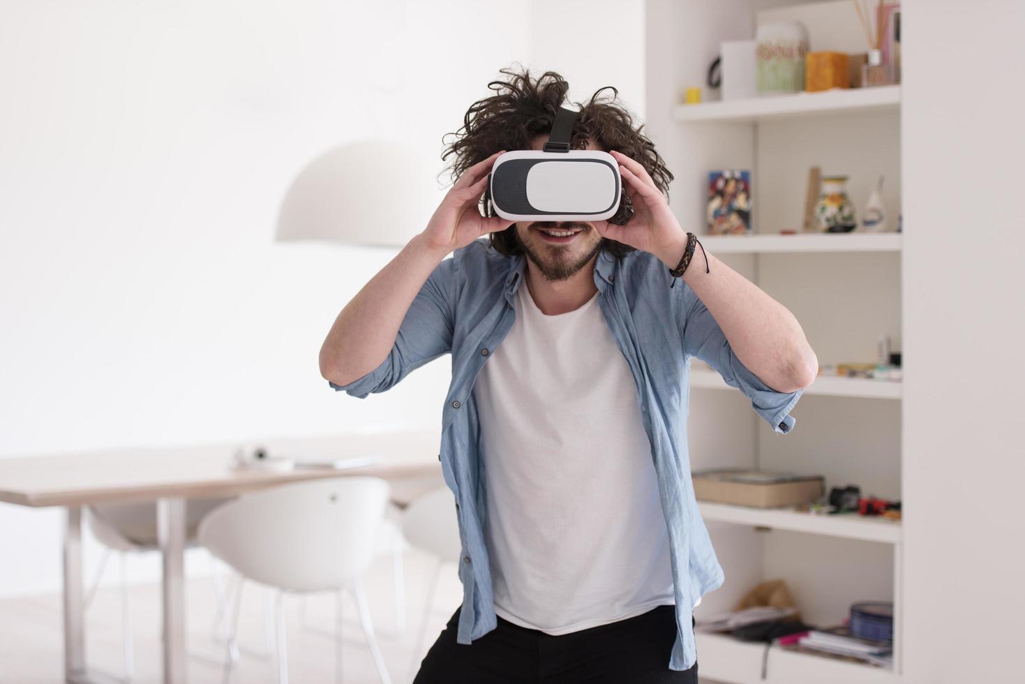 man using VR-headset glasses of virtual reality photo