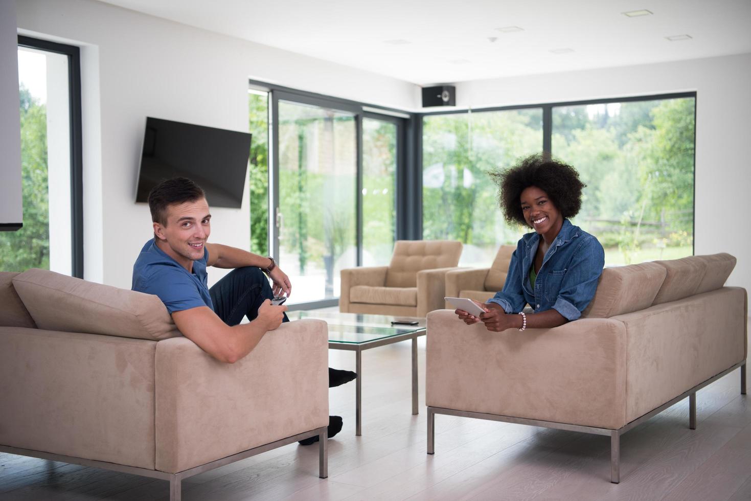 multiethnic couple in living room photo