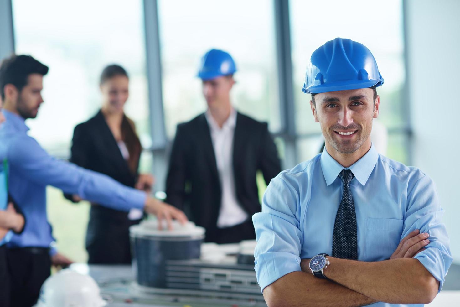 business people and engineers on meeting photo