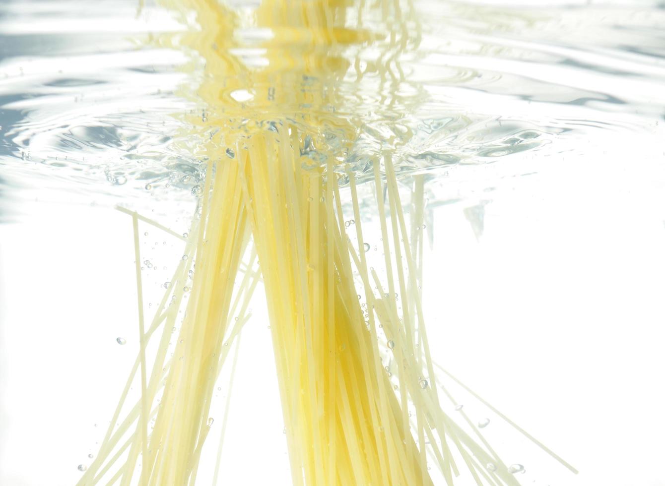 pasta cooking in water photo