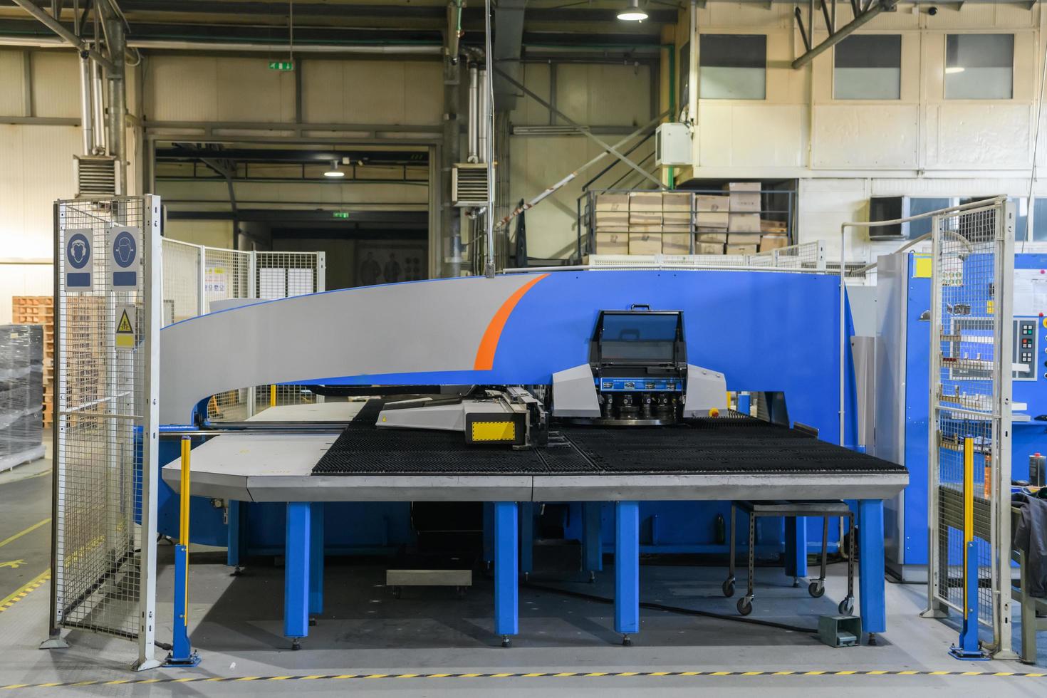 CNC Plasma cutter machine in big metal industrial hall photo