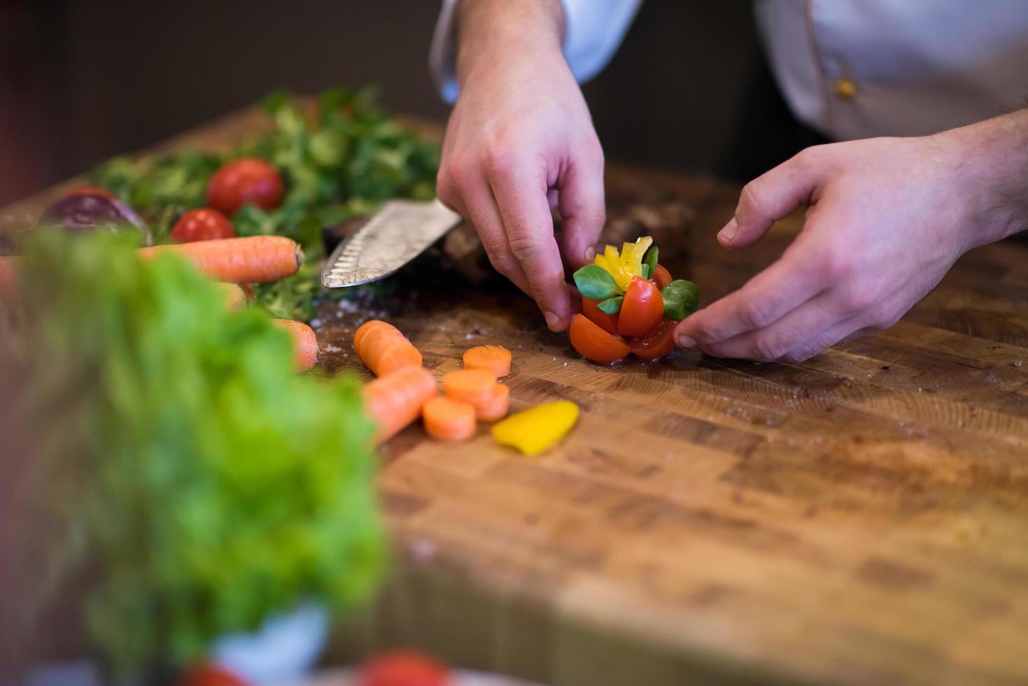 closeup of Chef hands preparing beef steak photo