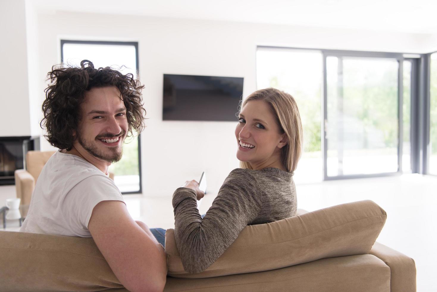 Rear view of couple watching television photo