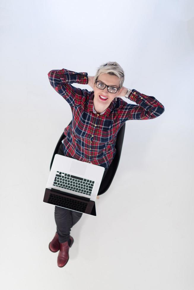 top view of young business woman working on laptop computer photo