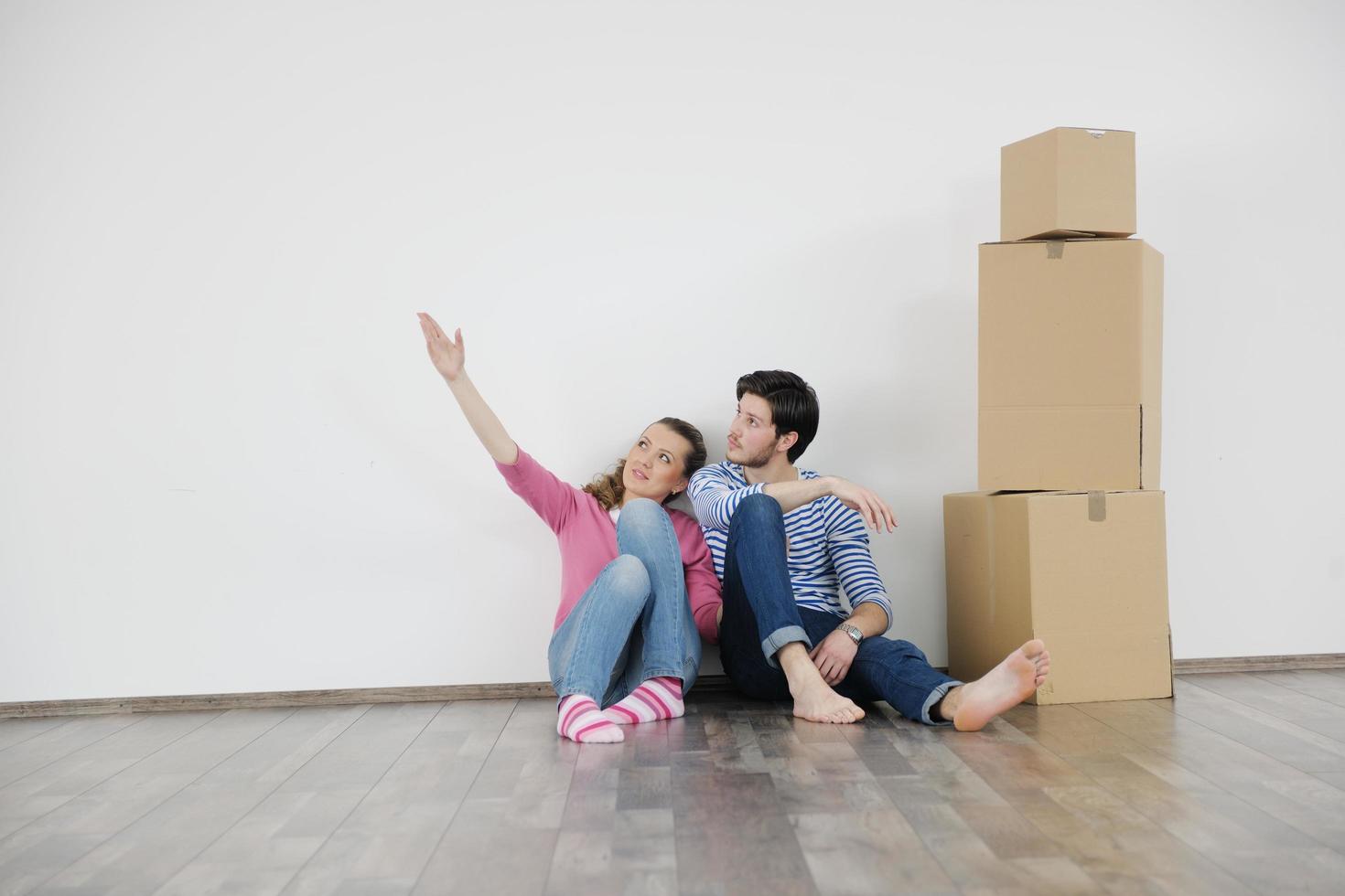 Young couple moving in new house photo