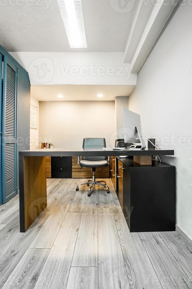modern designer desk for office, business and creative spaces, Wooden desk in black color with storage drawers. photo