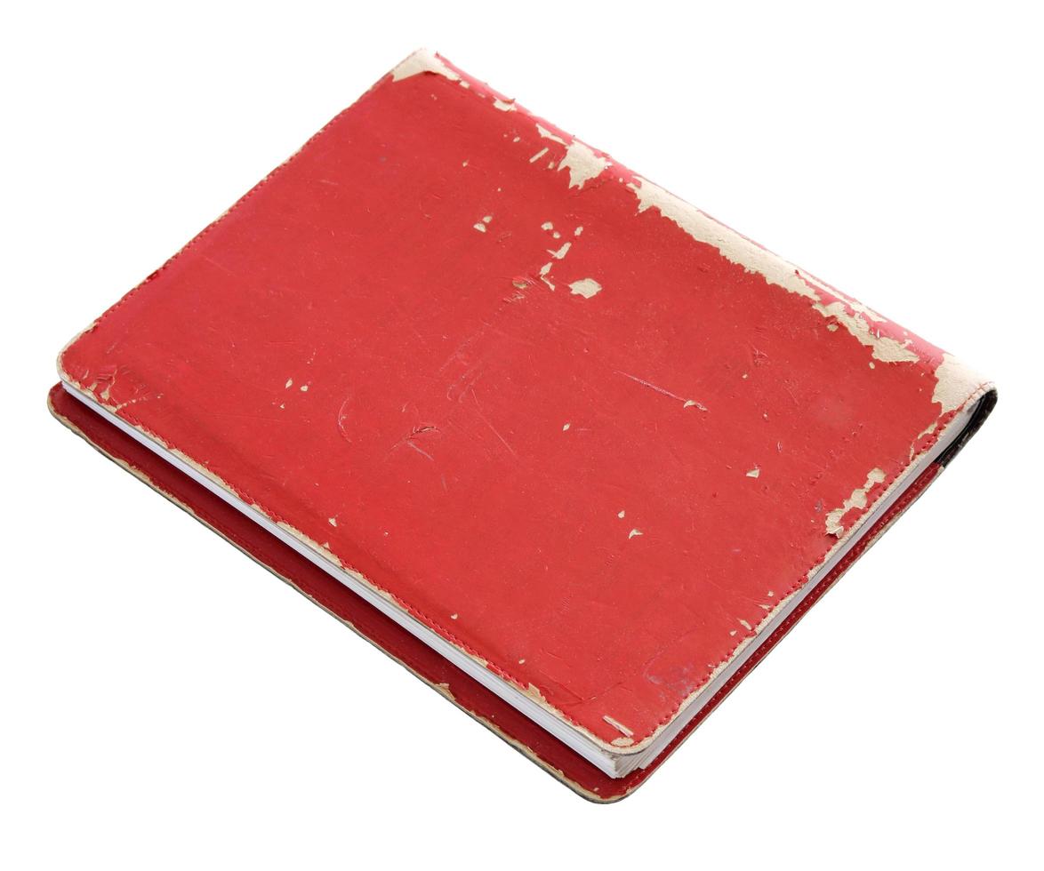Old red cover book isolated over white with clipping path photo