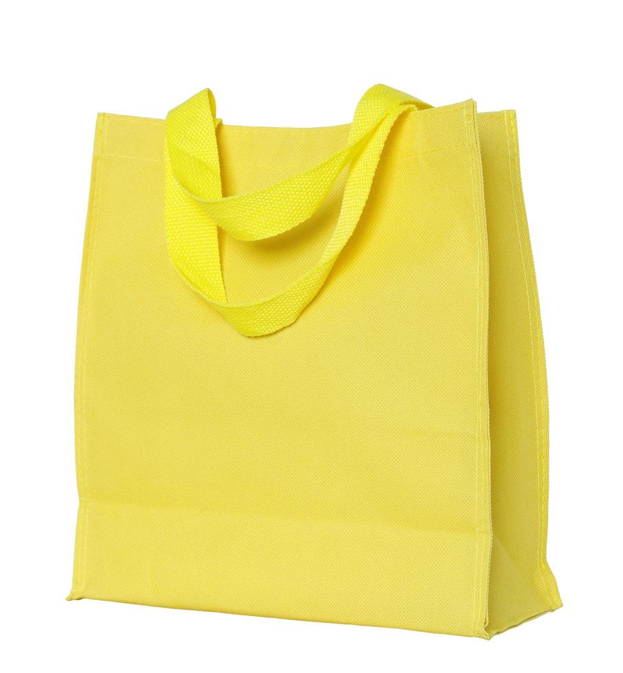 yellow canvas shopping bag isolated on white background with clipping path photo