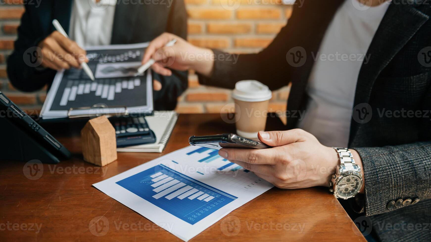 Business team meeting. professional investor working new start up project. Finance task. with smart phone and laptop and digital tablet computer  in morning light photo