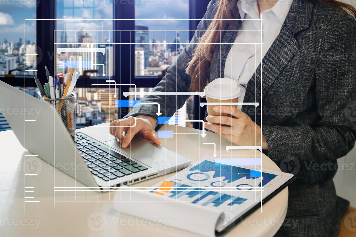 Project manager working and update tasks with milestones progress planning and Gantt chart scheduling diagram. business working with smart phone, tablet and laptop in office. photo