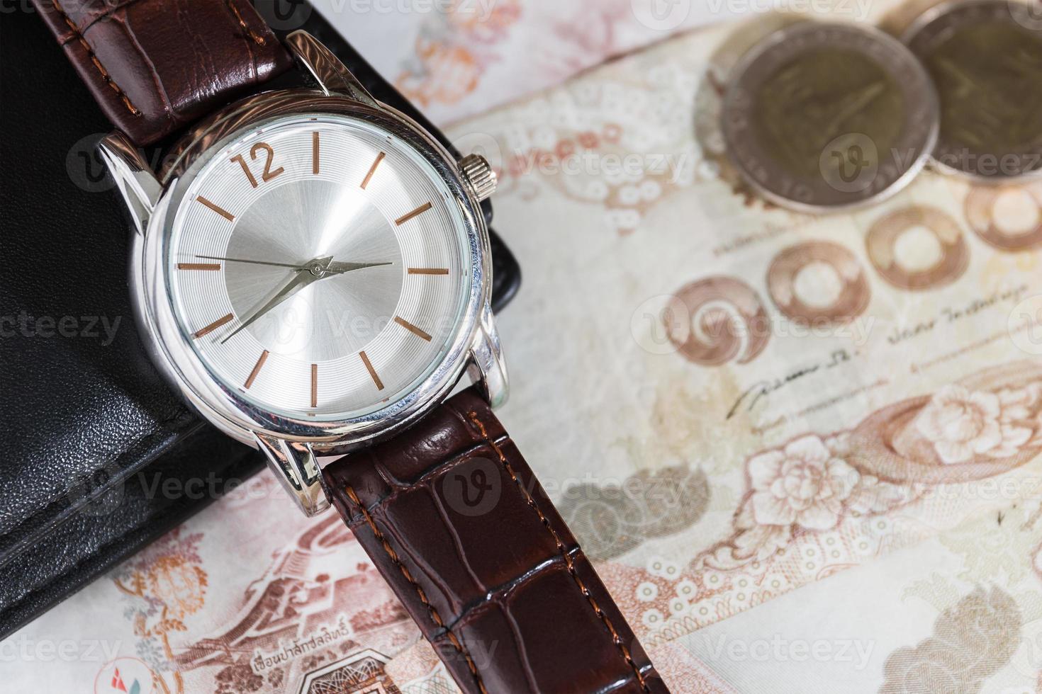 Watch and wallet on banknote photo