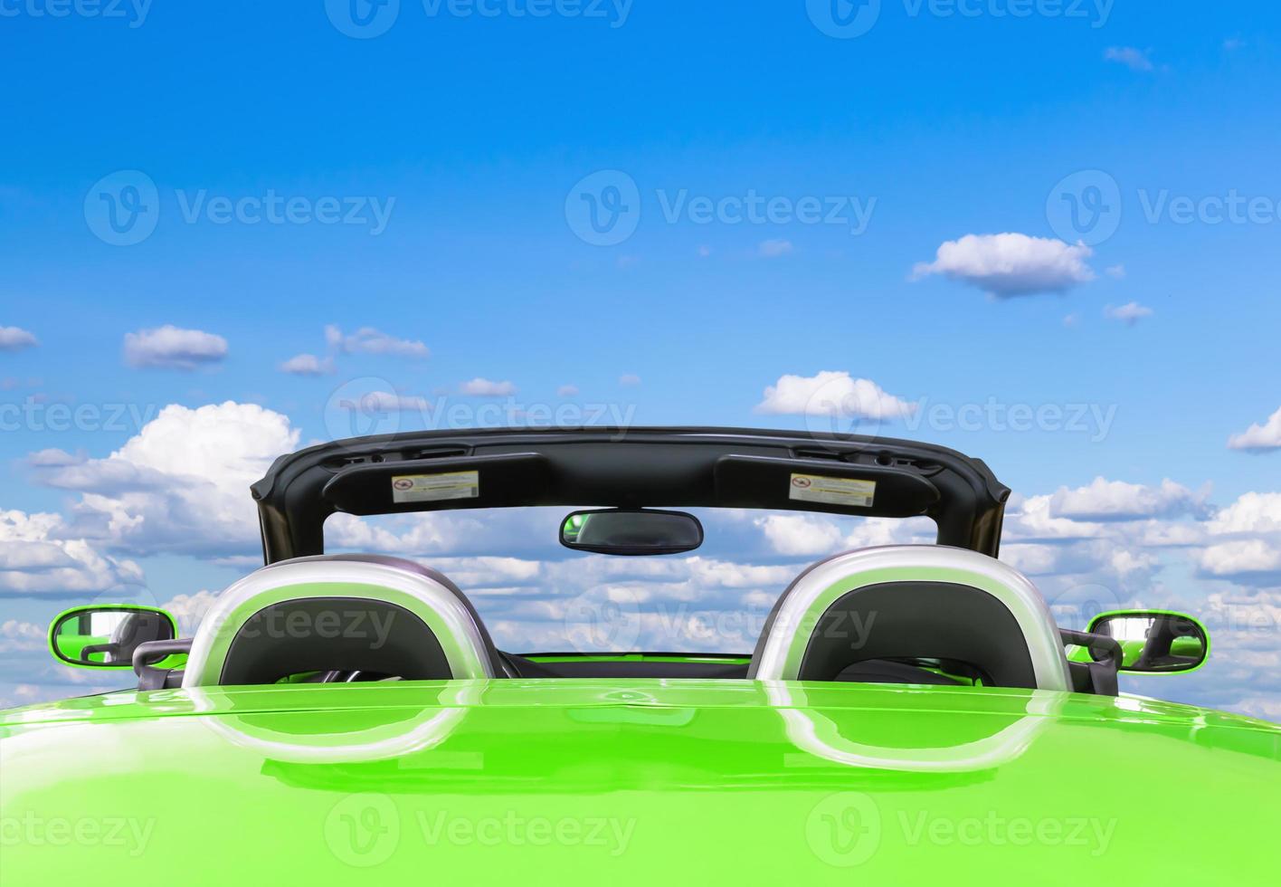 Green car with blue sky background photo