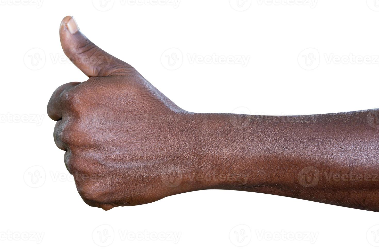 Closeup of male hand showing thumbs up sign against white background photo