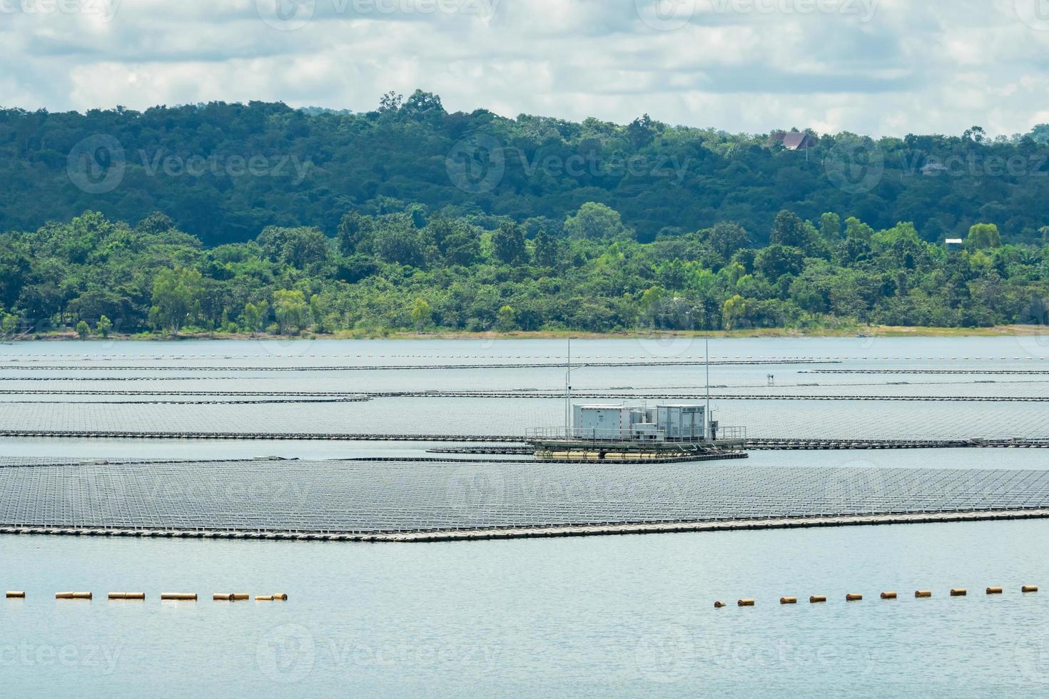 Floating solar farm or floating photovoltaics. Solar power. Landscape of solar panels floating on water in reservoir or lake. Solar technology. Alternative renewable energy. Sustainable resources. photo