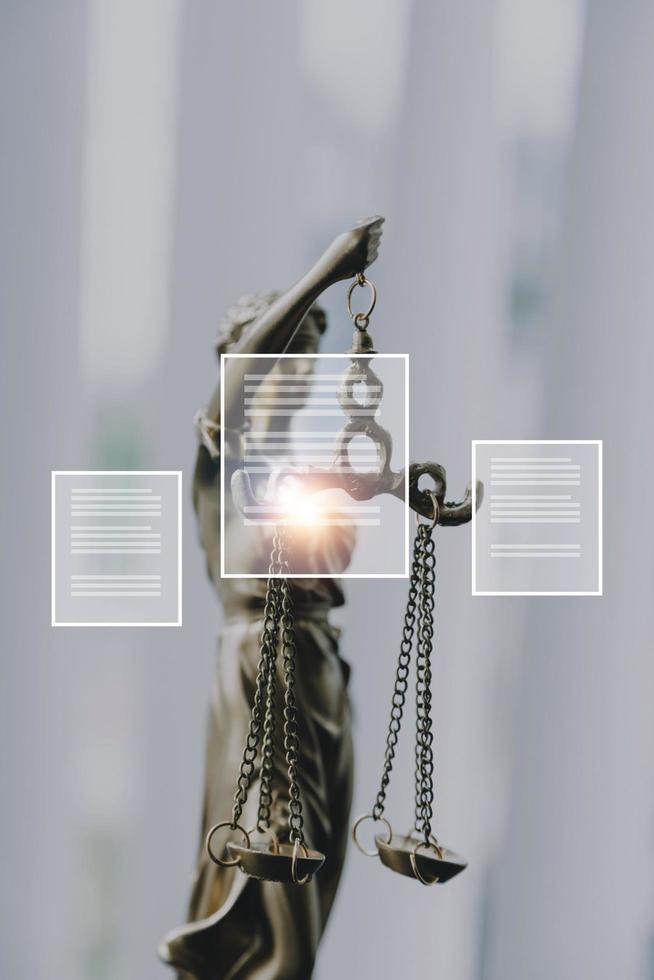 Justice and law concept.Male judge in a courtroom with the gavel, working with, computer and docking keyboard, eyeglasses, on table in morning light photo