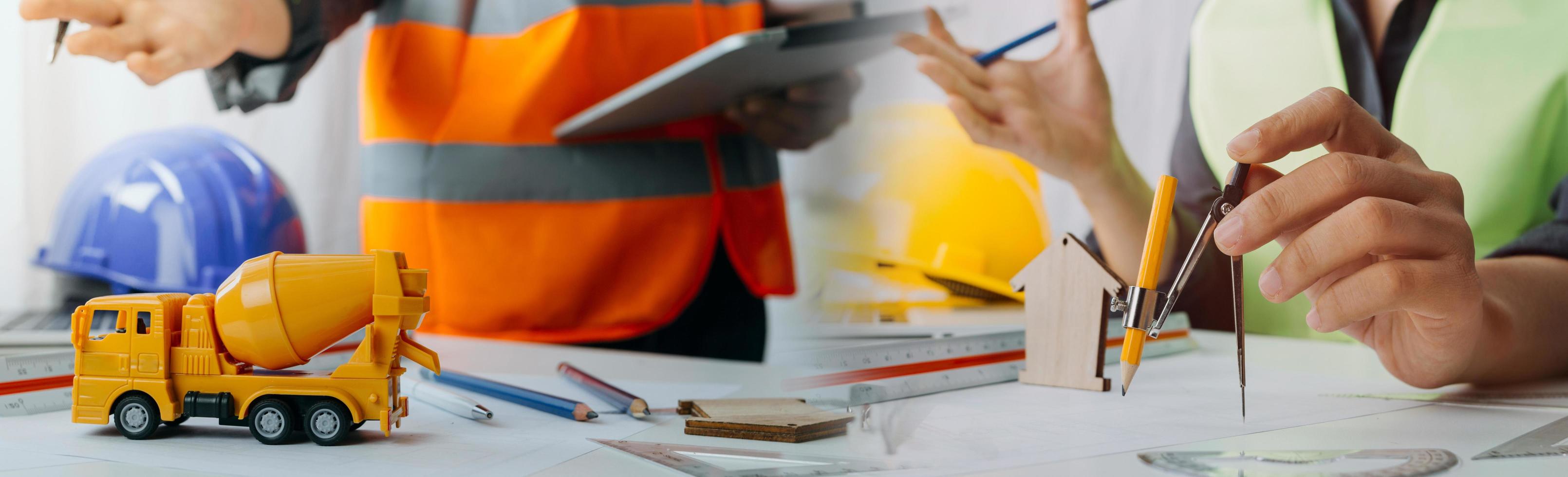 Two colleagues discussing data working and tablet, laptop with on on architectural project at construction site at desk in office photo