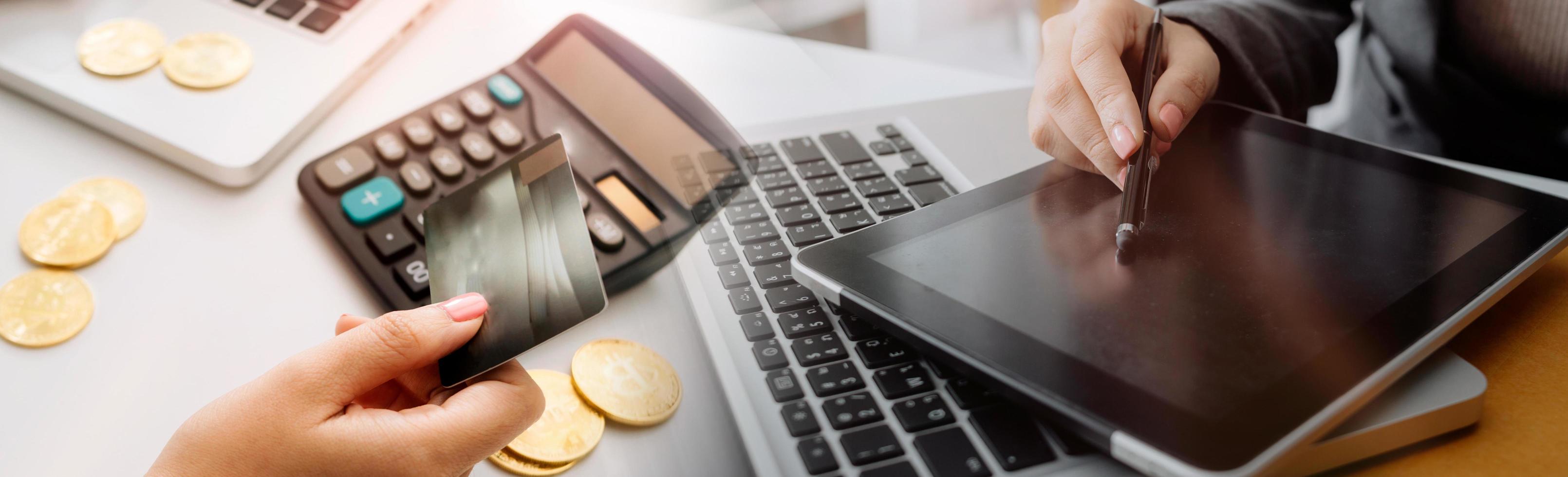 Business accounting concept, Business man using calculator with computer laptop, budget and loan paper in office. photo