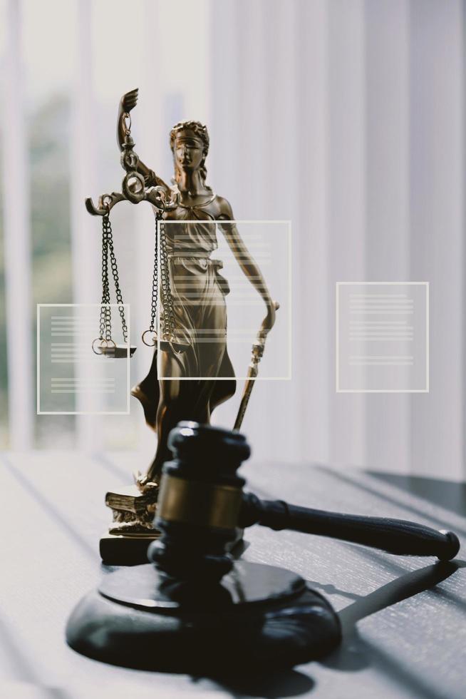 Justice and law concept.Male judge in a courtroom with the gavel, working with, computer and docking keyboard, eyeglasses, on table in morning light photo