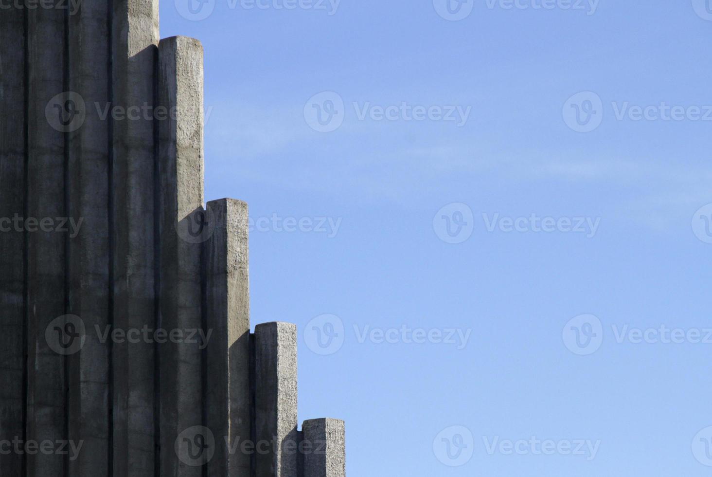 Concrete pillars against a blue sky photo