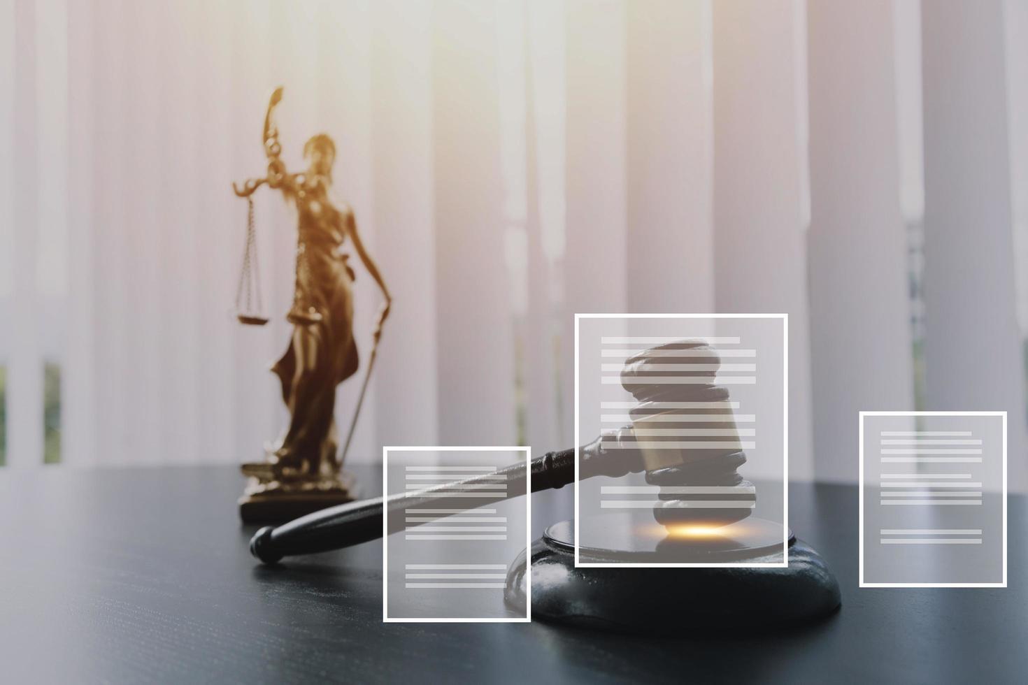 Justice and law concept.Male judge in a courtroom with the gavel, working with, computer and docking keyboard, eyeglasses, on table in morning light photo