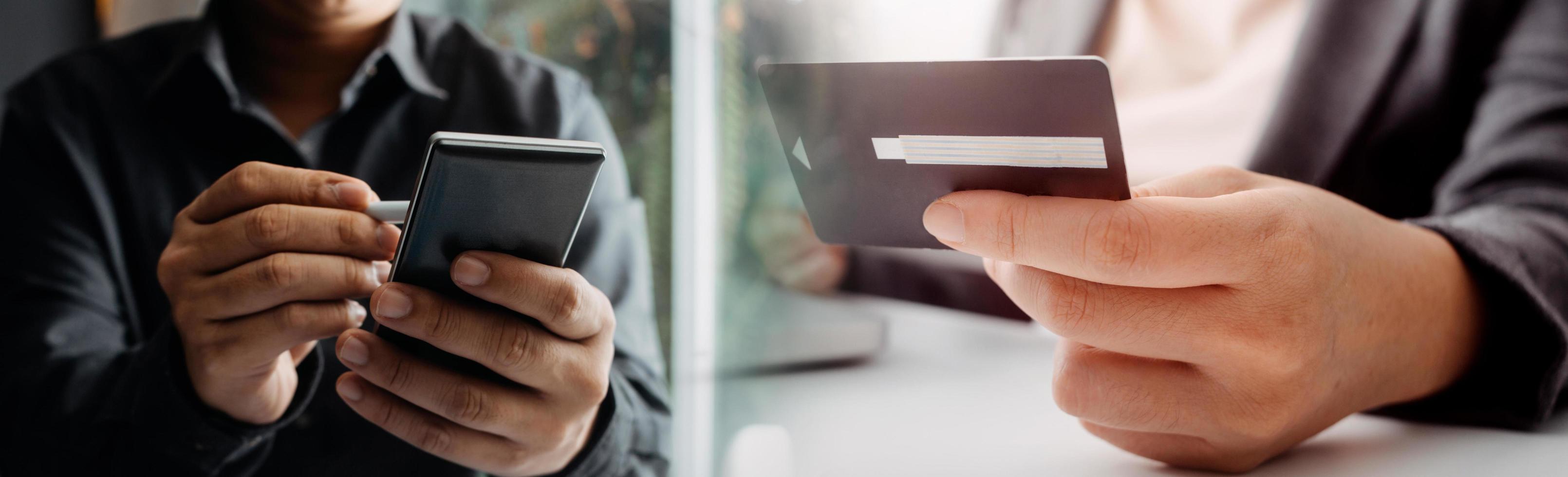 technology, people and online shopping concept - happy smiling man with tablet pc computer and credit card at home photo