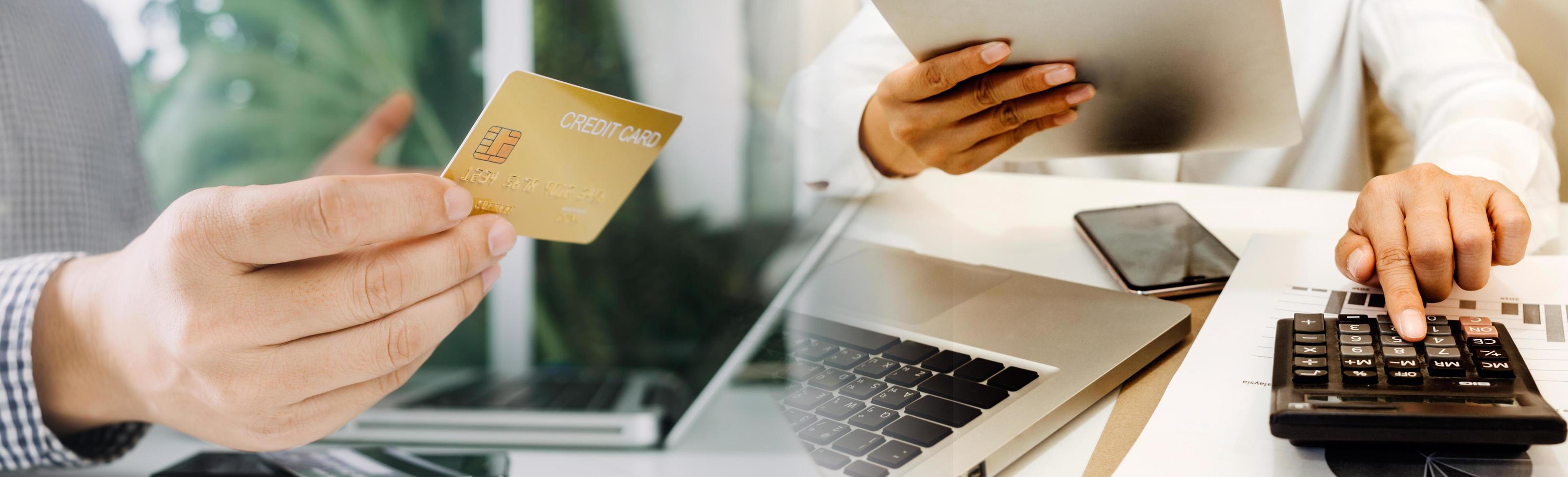 technology, people and online shopping concept - happy smiling man with tablet pc computer and credit card at home photo