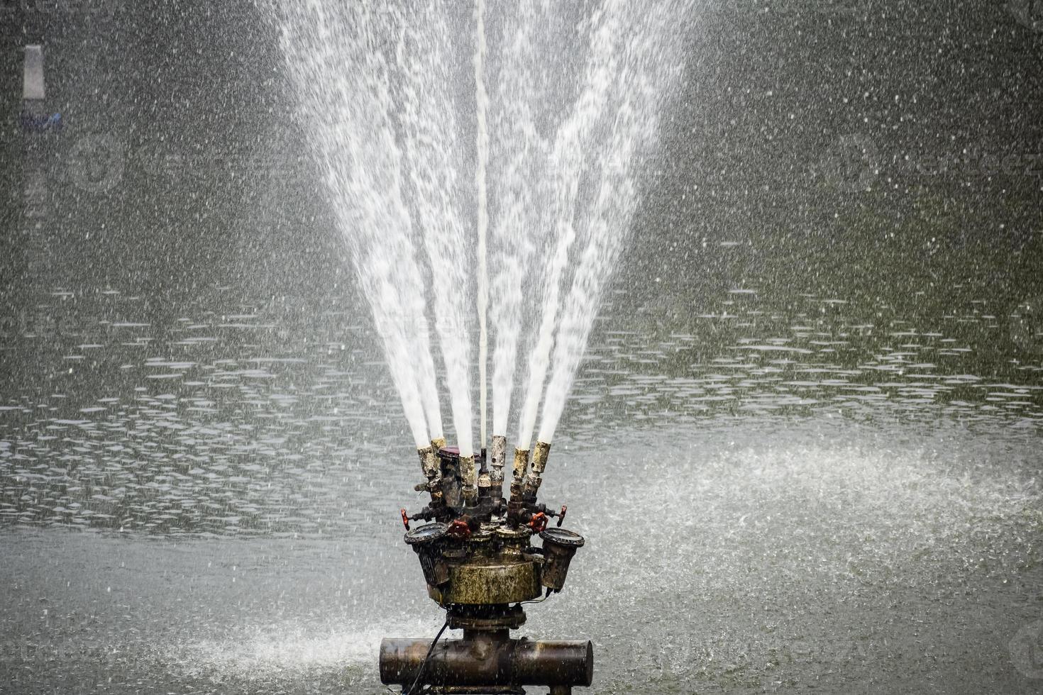 Fountain in the complex of Lodhi Garden in Delhi India, working fountain in the Lodhi Garden complex, water in the fountain, fountain in the Lodhi Garden park during morning time photo