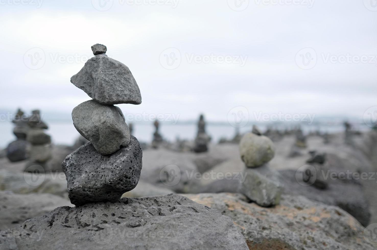 Balance - stacked stones at the coast of Reykjavik, Iceland photo