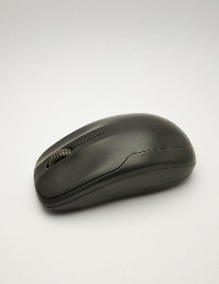 BLACK WIRELES COMPUTER MOUSE WITH WHITE BACKGROUND photo