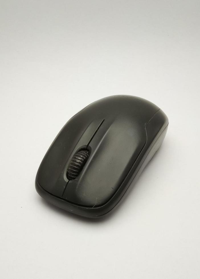 BLACK WIRELES COMPUTER MOUSE WITH WHITE BACKGROUND photo