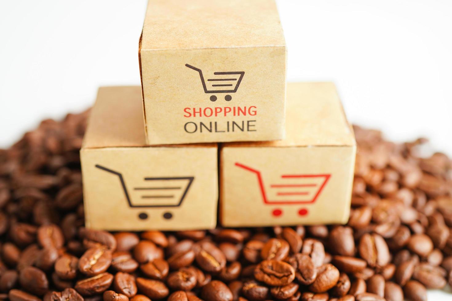 Shopping cart box on coffee beans, shopping online for export or import. photo