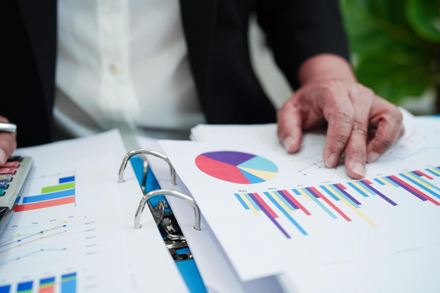 Business woman working and analysis with statistic graph in office. photo