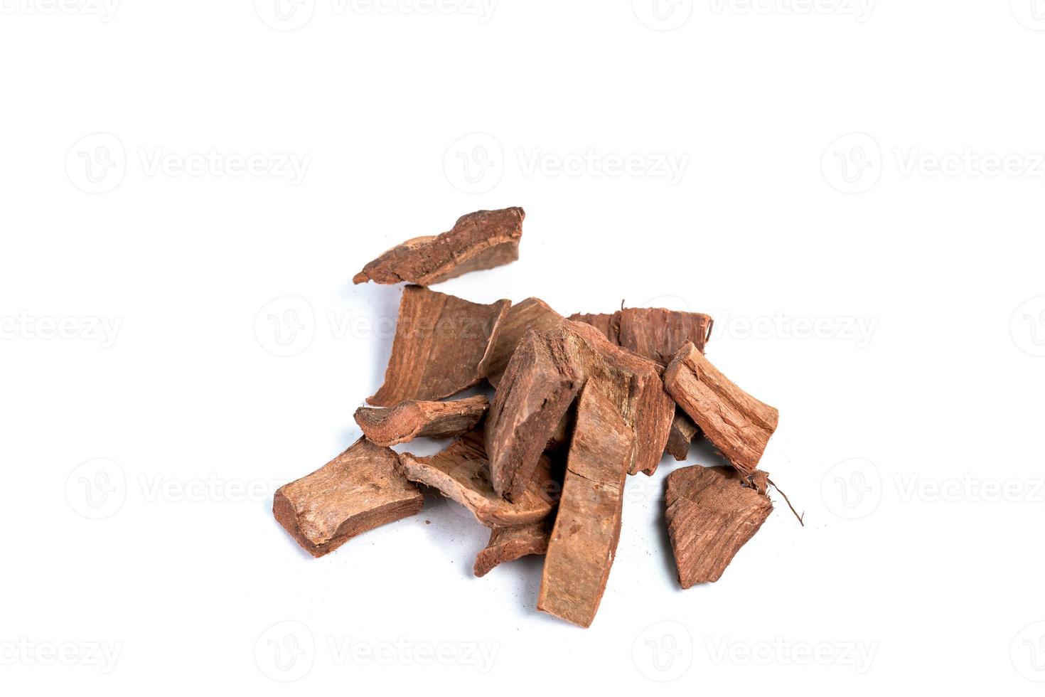 Dry arjun chal powder or Terminalia arjuna ayurvedic herb on white background photo