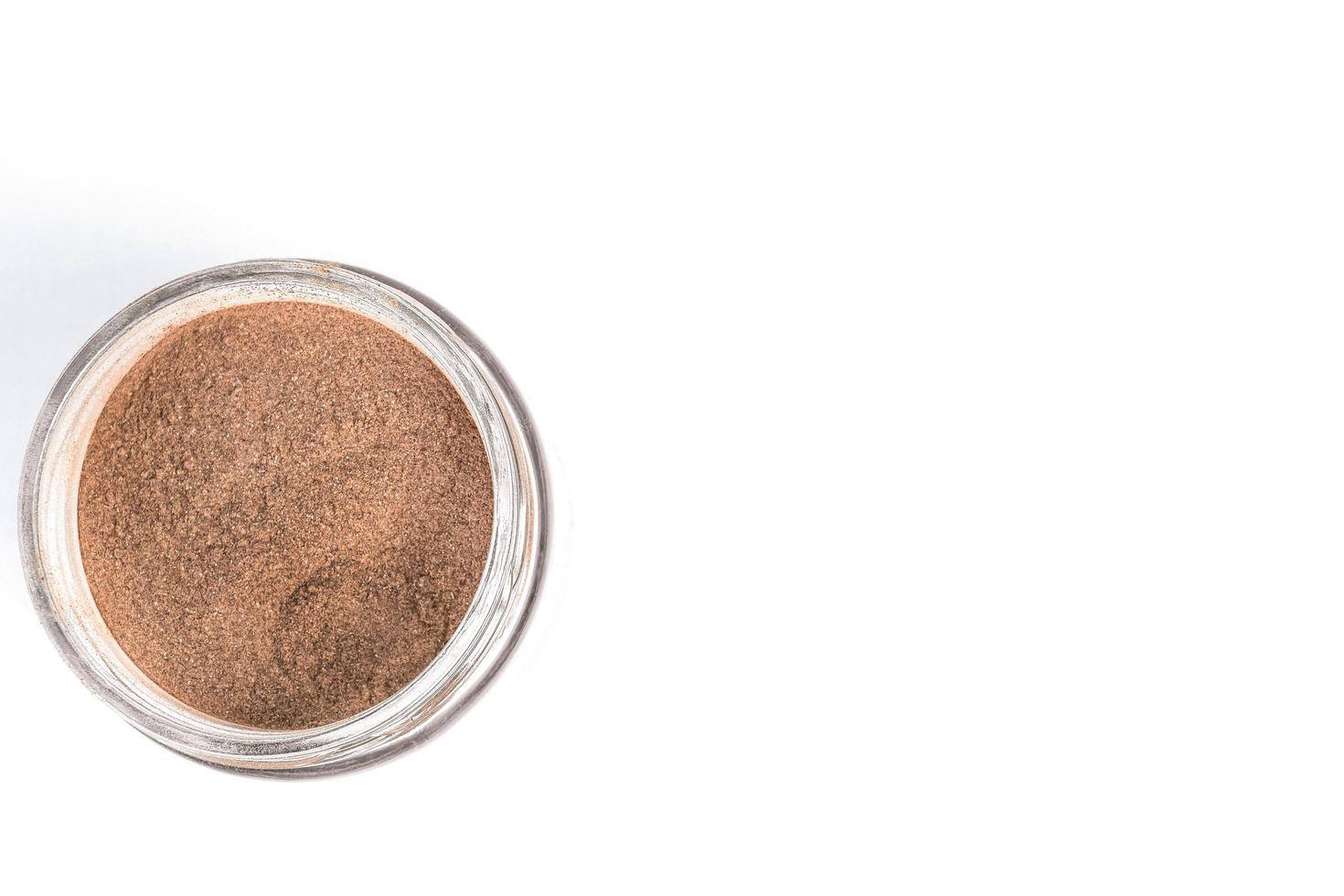 Dry arjun chal powder or Terminalia arjuna ayurvedic herb on white background photo
